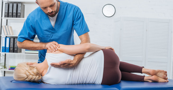 Schroth Method exercise on a doctor table