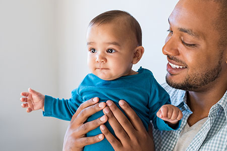 young child with father after pediatric plastic surgery