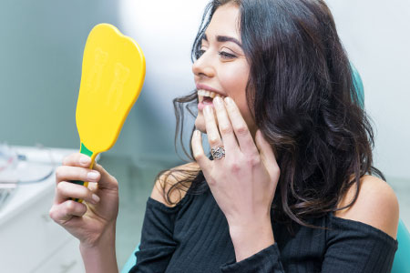 woman with a new dental implant