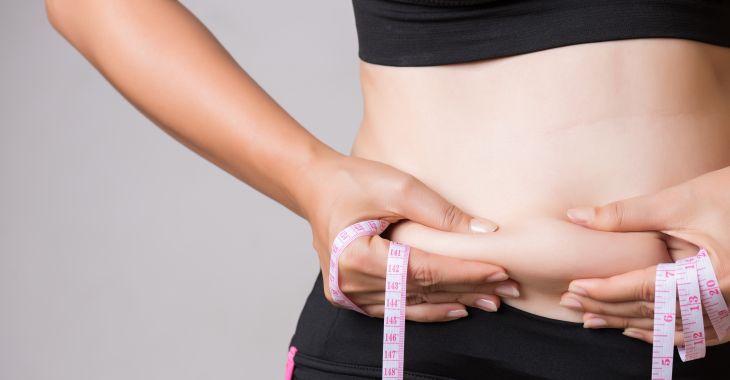 Woman With Excessive Fat At Her Waistline Considering CoolSculpting Procedure