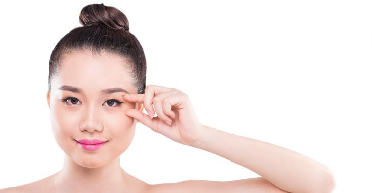 Young Asian woman considering double eyelid surgery