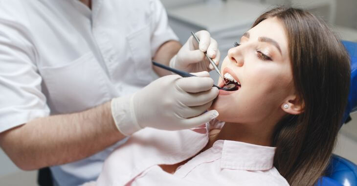 Young woman in a dental chair having her coming in wisdom tooth checked up