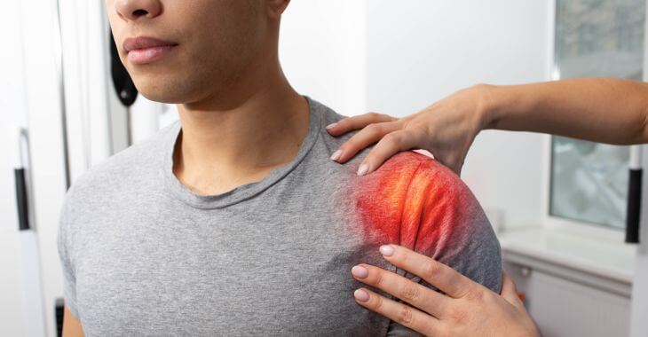 A doctor checking how is the patient's shoulder healing after surgery.