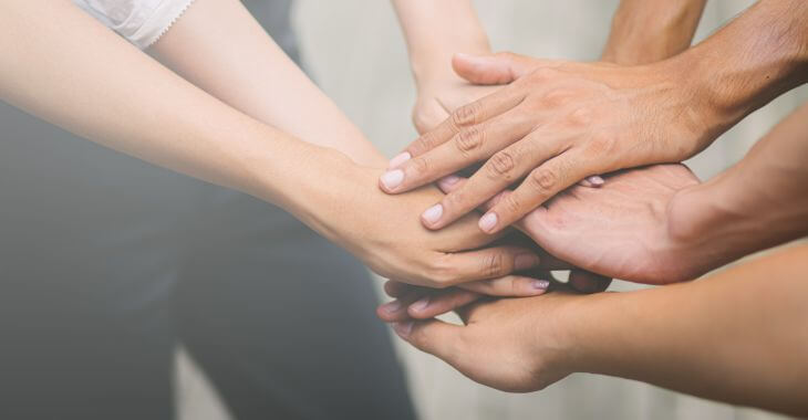 Hands of people of different ages.