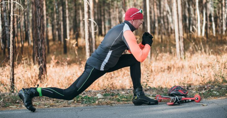 An athlete stretching before roller skating.