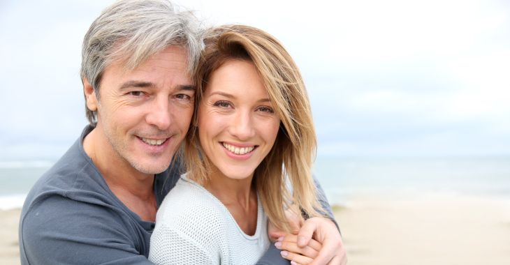 Joyful mature couple with perfect smiles.