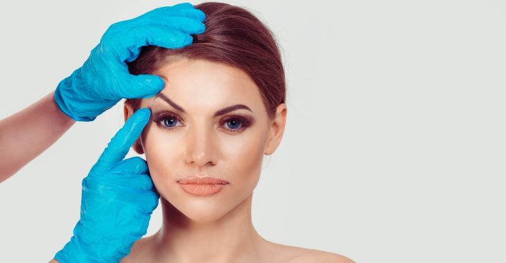 Plastic surgeon consulting woman before eye cosmetic surgery. 