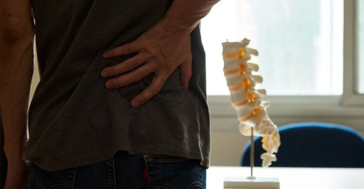 A patient suffering from a lumbar pain at a doctor's office.