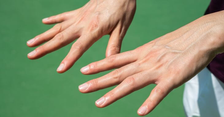 A person looking at their hands veins.