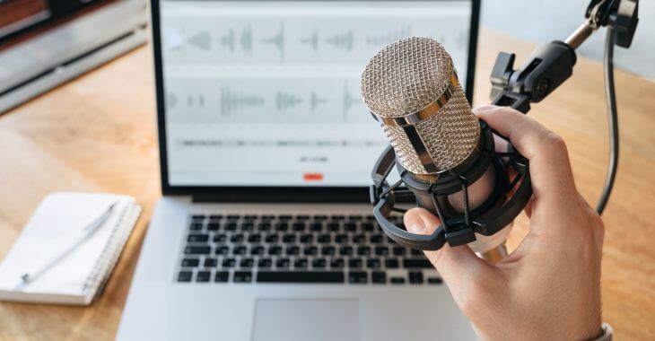 A person recording and editing podcasts.