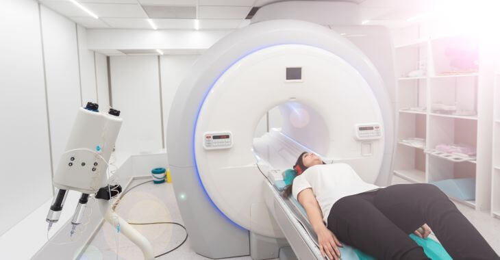 A woman during MRI scanning procedure.