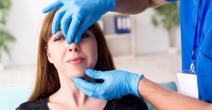 Woman during a consultation for turbinate reduction surgery.