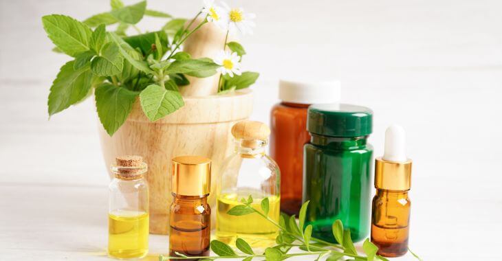 Variety of natural remedies for sinus problems including essential oils, herbal pills and green herbs.
