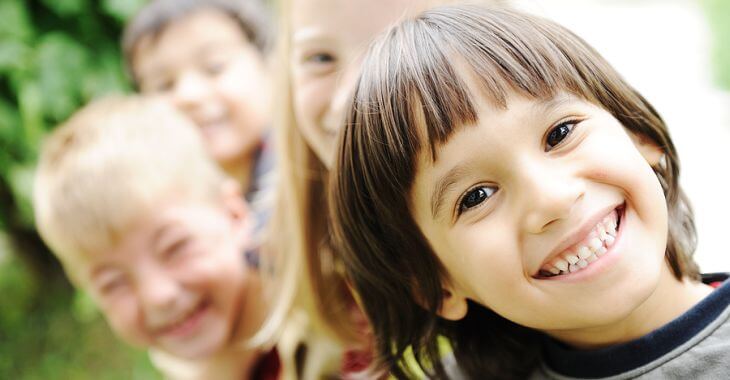 cheerful toddlers playing outdoors