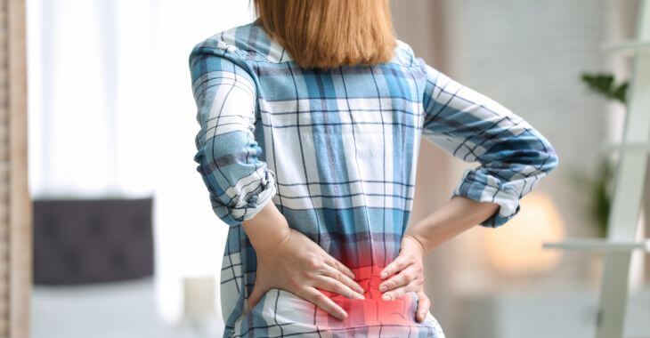 Woman with strong lower back pain